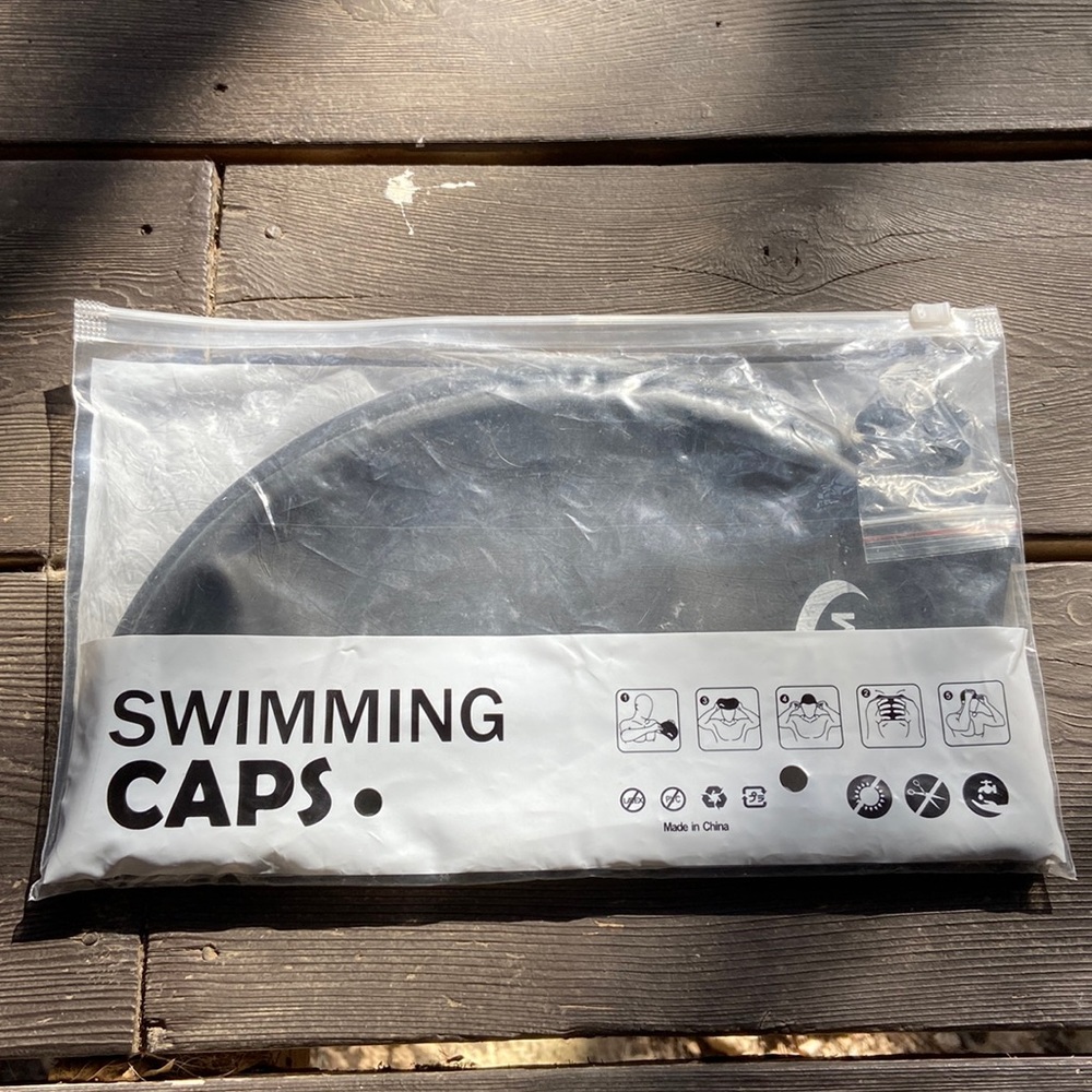 Opom XL swimming capi clises ear and nose plugs. Never used